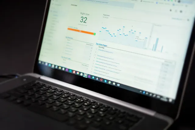 Close-up of a laptop showing an analytics dashboard